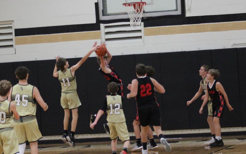 Photo by Kendra Coker Brady Reynolds, No. 1, grabs the ball to prevent a score from a Wildcat.