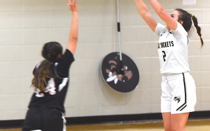 Gary Corsair • Clay County Progress Hayesville standout Lila Roberts, No. 2, dials long distance against Andrews. Roberts banged home 5 shots from 3 point range to lead the Lady Yellow Jackets to a 47-28 triumph.