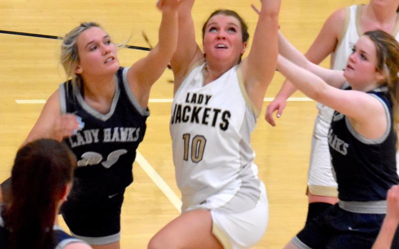 Gary Corsair • Clay County Progress Lakota Shelton, No. 10, keeps her eyes firmly fixed on the prize as she rebounds in traffic against Nantahala. Shelton plucked the Eagles for eight rebounds and 7 points, both career highs, as Hayesville rolled to a 68-22 win in The Hive on Monday night. That's Breanna Abrams watching her teammate get busy.