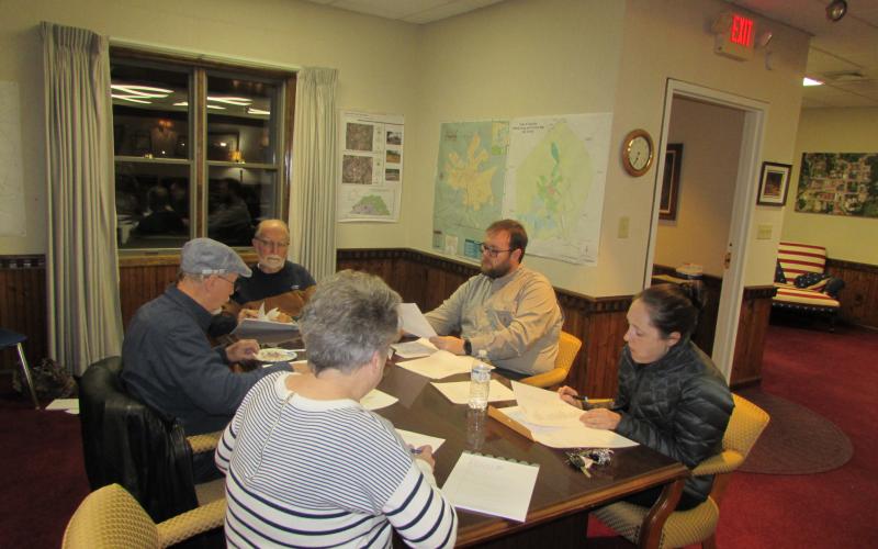 Mayor Joe Slaton and council members Harry Baughn, Austin Hedden and Lauren Tiger and Town Clerk/Finance Officer Suzanne Hedden prepare for Monday’s meeting.