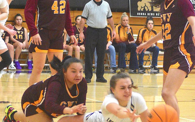 Gary Corsair • Clay County Progress Hayesville senior Lila Roberts, No. 2, pushes the ball to a teammate after being knocked to the floor against Cherokee.