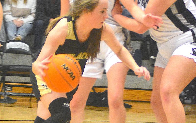 Gary Corsair • Clay County Progress Breanna Abrams, No. 4, cuts through the heart of the Robbinsville defense on a bold drive.
