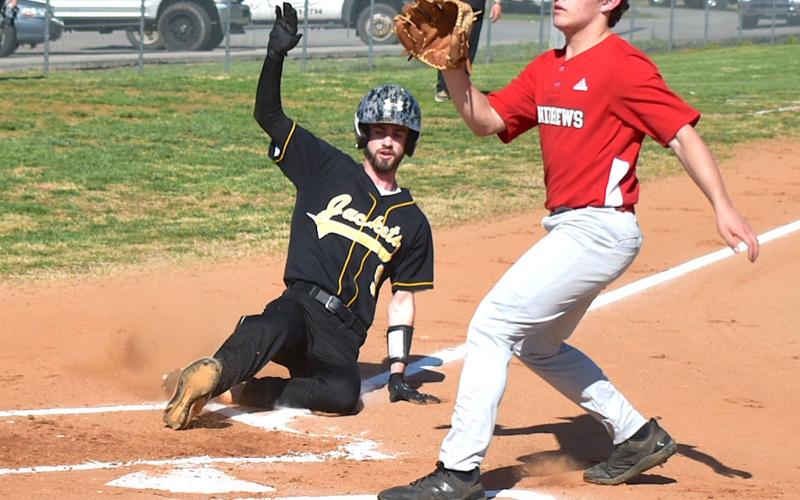 Gary Corsair • Clay County Progress Cade Denton slides home with Hayesville's fourth in the Yellow Jackets 24-0 shellacking of Andrews on Monday.