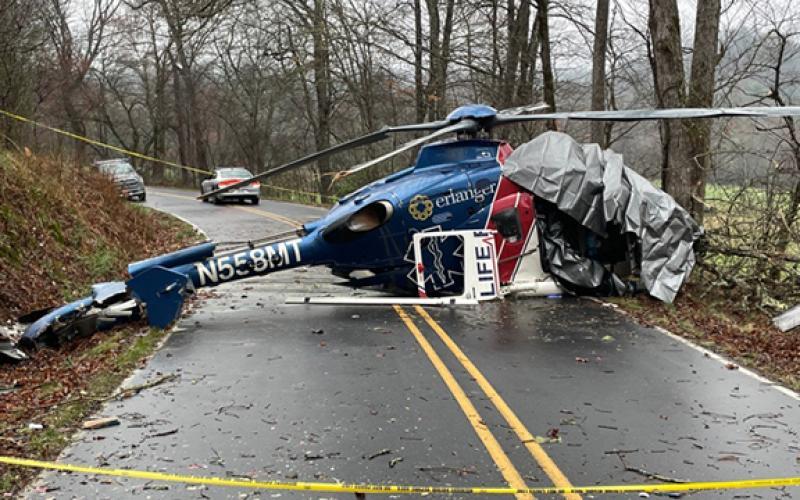 Wreckage of Life Force 6 blocks Middle Burningtown Road in Macon County on Friday on the morning following a crash. All four aboard survived.