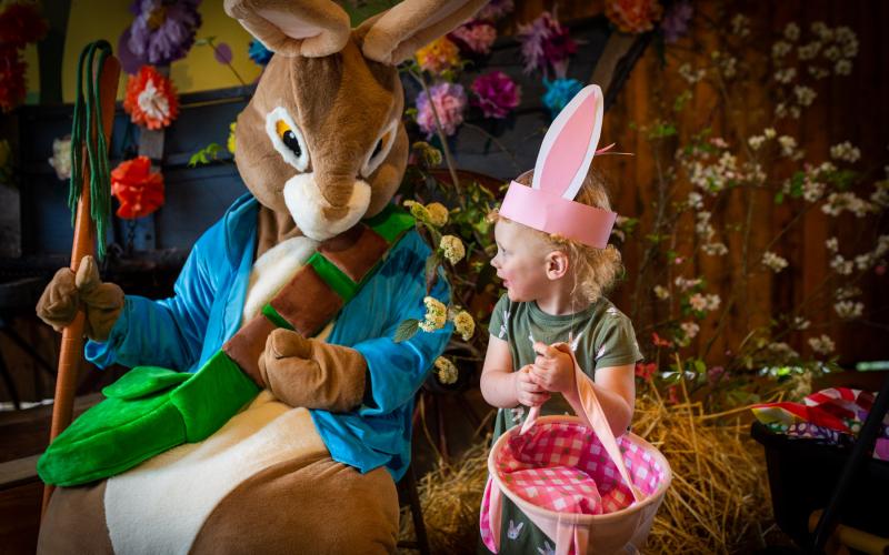 Robert Grand • John Campbell Folk School Madison Rose Handford is excited to see the Easter Bunny at the folk school. The rain did not stop the fun of the hunt.