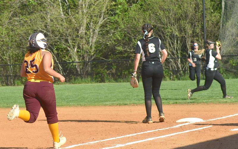 Gary Corsair • Clay County Progress Hayesville second baseman Raylyn Taylor, No. 11, catches a pop-up on the run near the fi rst base foul line.