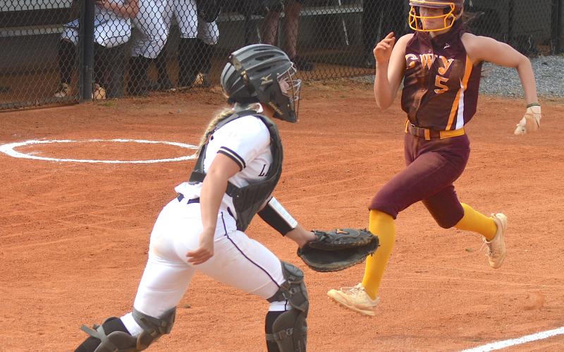 Gary Corsair • Clay County Progress Hayesville catcher Faith Odell waits for a throw from the outfield as Cherokee scores another run.