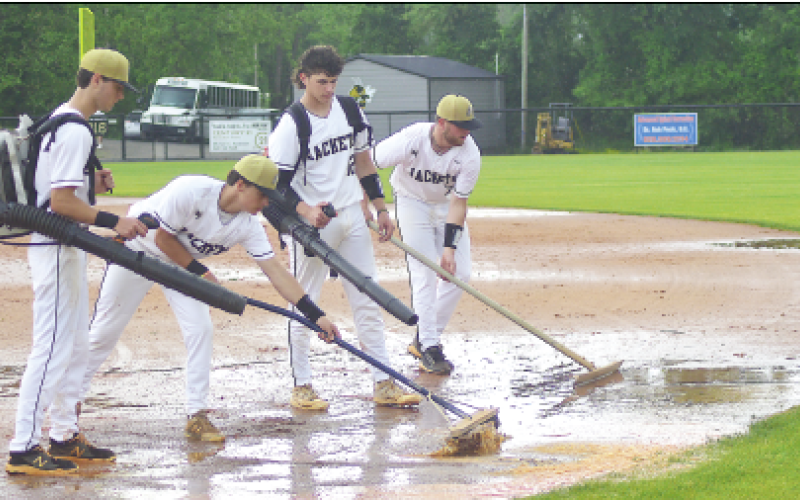 Gary Corsair • Clay County Progress Dakota Matheson, Chance Hughes, Avery Leatherwood and Kyle Lunsford dry the Scott D. Penland Field skin after a downpour halted Friday’s playoff game with Eastern Randolph. Players, coaches and ground crew did a remarkable job of restoring the diamond with an assist from A+ Lawn Care, but it was decided to continue the game Saturday.