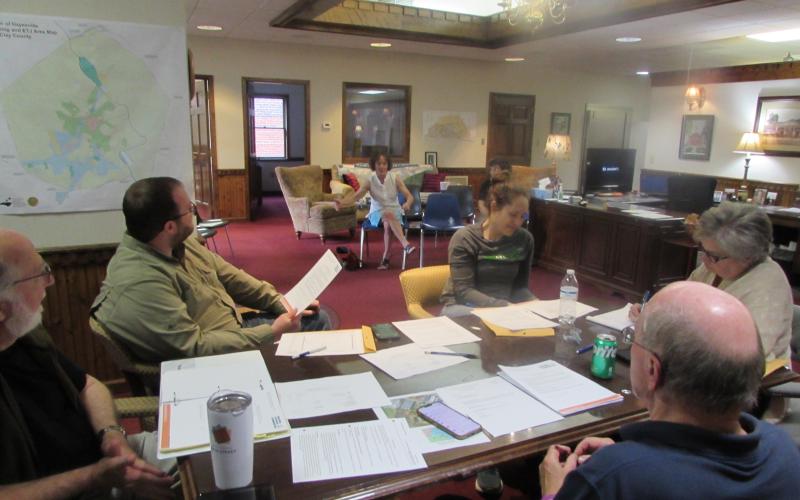Joanna Atkisson, of the Building Outdoor Communities Program, briefs Town Council members on the need for a community resolution.