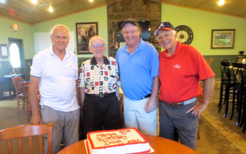 Richard Woodruff, Doug Stuart, Steve Christie and Lee Durham celebrate a landmark with the 90th birthday of Doug Stuart at the Chatuge Shores Men’s Golf Association.
