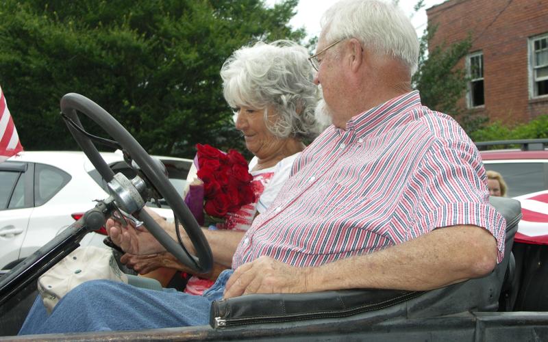Commissioner Clay Logan takes the opportunity to wish his wife Judy a happy 54th anniversary on July 4th with a bouquet of roses.