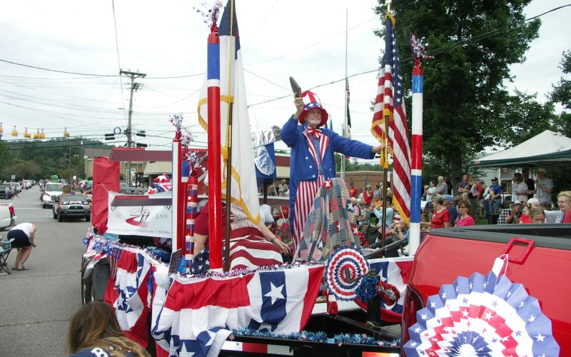 Deby Jo Ferguson • Clay County ProgressFirst Freewill Baptist Church and Carolina Christian Academy show off their patriotism with a beautiful red, white and blue float complete with Uncle Sam during Tuesday’s Fourth of July Parade on the Hayesville town square. Crowd size appeared much larger than in previous years. Visitors enjoyed games, music, food and the parade procession  which included cars, extravagant floats and a slew of spectators on the sidelines. The day marked America’s 247th birthday. In the