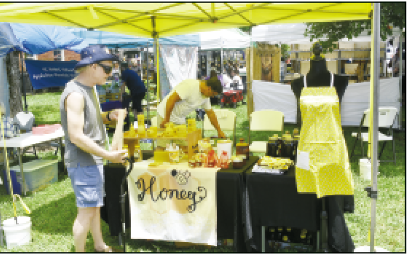 Becky Long • Clay County Progress G’s Bees Apiary’s booth offers an array of UGA certified local raw honey and products. The business is owned by Jim and Guylaine Crabtree in Young Harris, Ga.