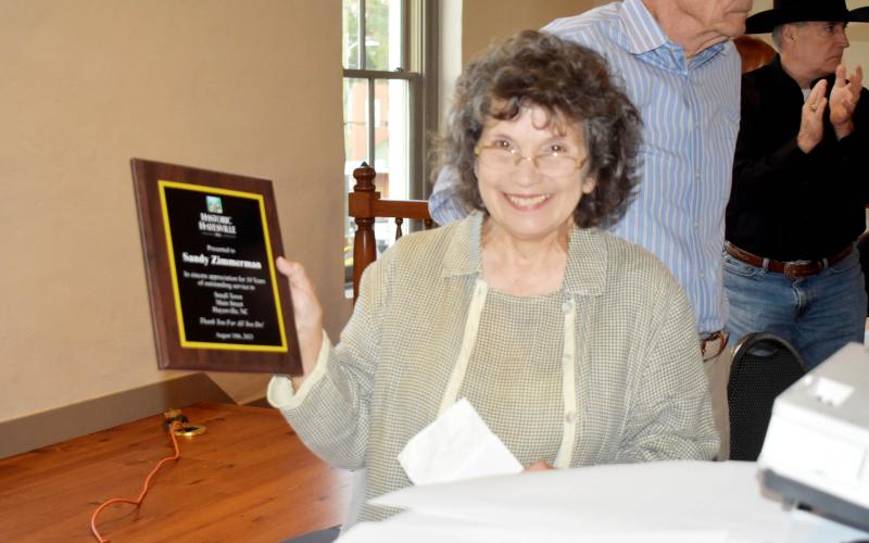 Becky Long • Clay County Progress Sandy Zimmerman holds the plaque from HHI for coordinating the Hayesville Small Town Main Street and over 10 years as volunteer.