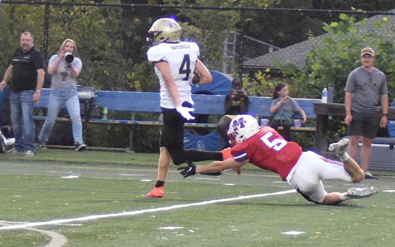 Gary Corsair • Clay County Progress Hayesville's Isaac Chandler, No. 4, did more than beat Madison with his exceptional kicking, he also ripped off a 48-yard gain in which he was tripped up just before reaching the goal line.