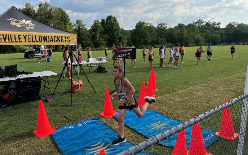 Evan Burks finishes his run at Hayesville cross-country meet.