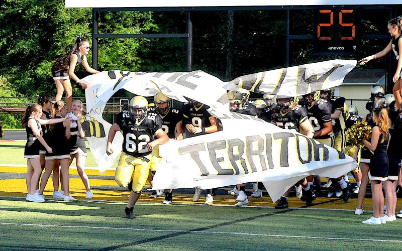 Gary Corsair • Clay County Progress Caden Robinson, No. 62, leads the JV Jackets onto the battlefield.