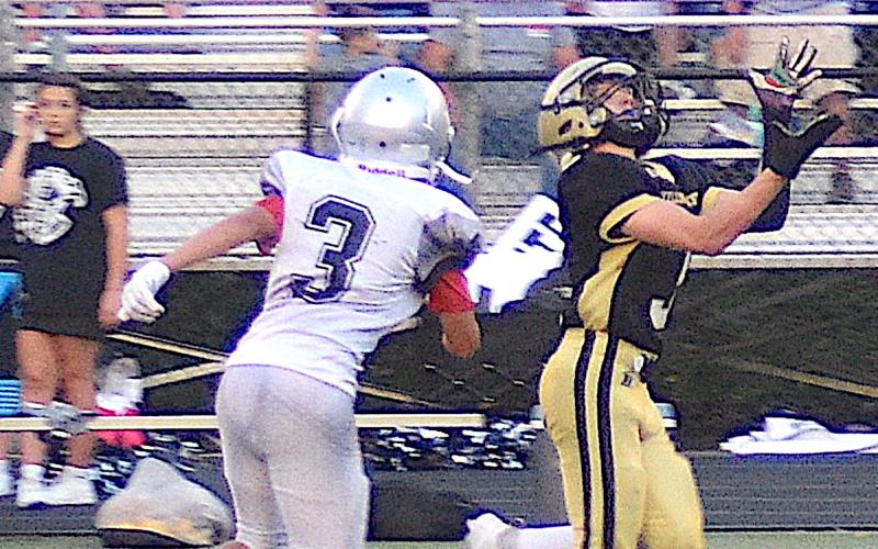 Gary Corsair • Clay County Progress Hayesville's Kabe Shaheen, No. 3, gathers in a pass from Lance Coker and leaves a Robbinsville defender in the dust on the way to a 74-yard touchdown for the JV Yellow Jackets Thursday.