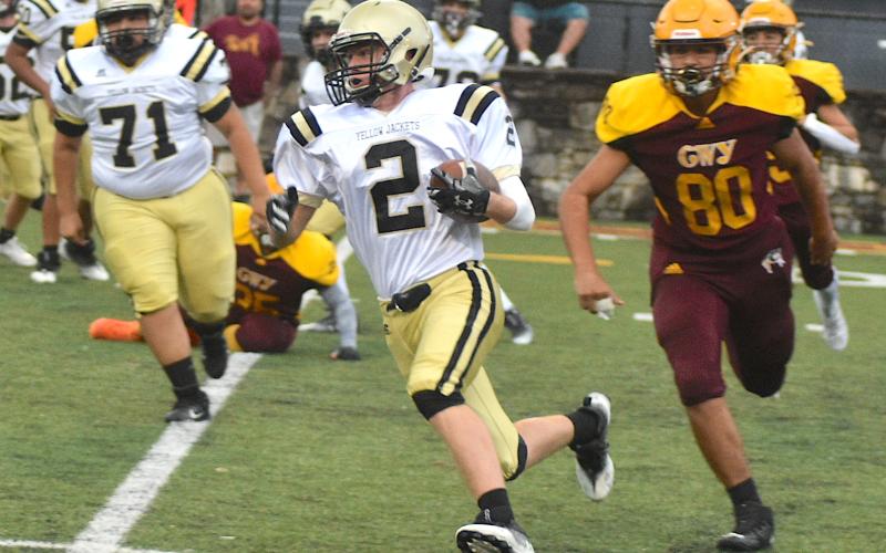 Gary Corsair • Clay County Progress Johan Webb, No. 2, puts the pedal to metal on the way to a Hayesville first down while teammate Jonathan Godinez-Diaz looks for a Brave to block.