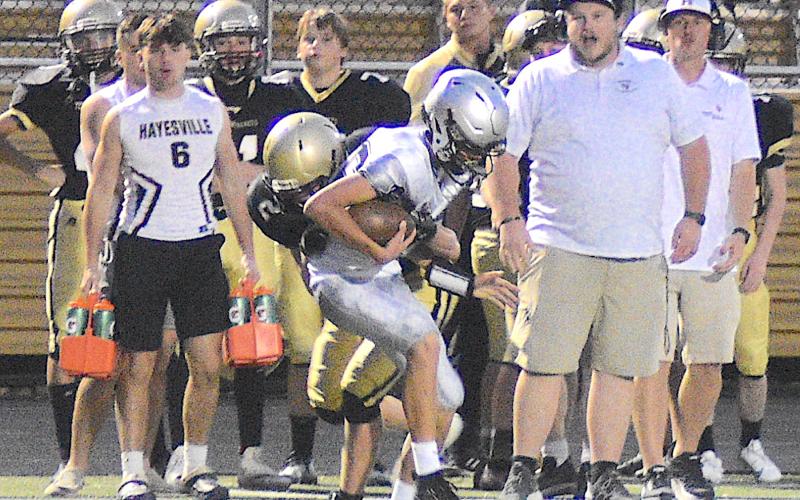 Gary Corsair • Clay County Progress Johan Webb, No. 2, hears the roar of approval from his sideline as he wrestles a Black Knight out of bounds.
