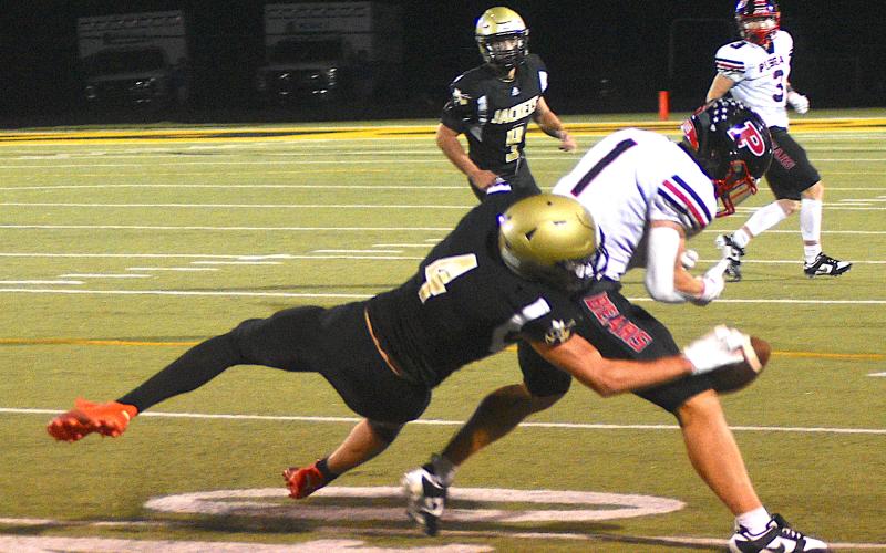 Gary Corsair • Clay County Progress Yellow Jacket Isaac Chandler, No. 4, breaks up a third-down Pisgah sideline pass. The Bears punted on the next play.