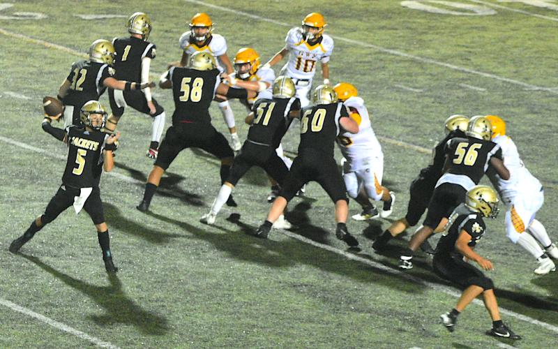 Gary Corsair • Clay County Progress   Hayesville's offensive linemen Peyton McGaha, No. 1, Dante Robinson, No. 58, E.J. Abrams, No. 51,  Lane O'Dell, No. 60, Patrick Denton, No. 50, Will Brown, No. 56, Dawson Devane, No. 32, and Cole Vining, No. 10, provide total protection for quarterback Tate Roberts, No. 5.