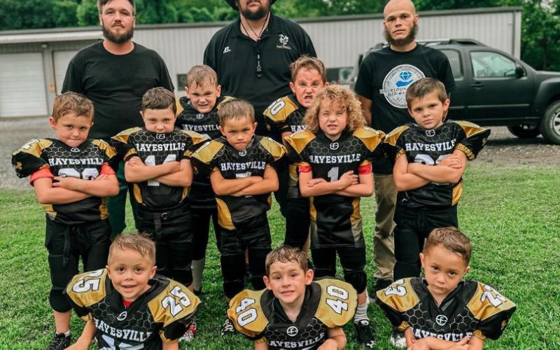 Gracie Taylor • Clay County Progress Pee Wee Youth Football team are, front, from left, Dreydan Williams,Charlie Tillary and Waylon Thurmond; middle, Anthony McClure, Harmon Cable, Jackson Garrett, Caycen Hill, Mason Long, Quinten Dyer and Grady Lovingood; back, Coaches Brian Dyer, Dayrion Williams and Tim Giddens. Not in picture is Noah Trapp, Noah Everett and Coach Johnny Garrett.