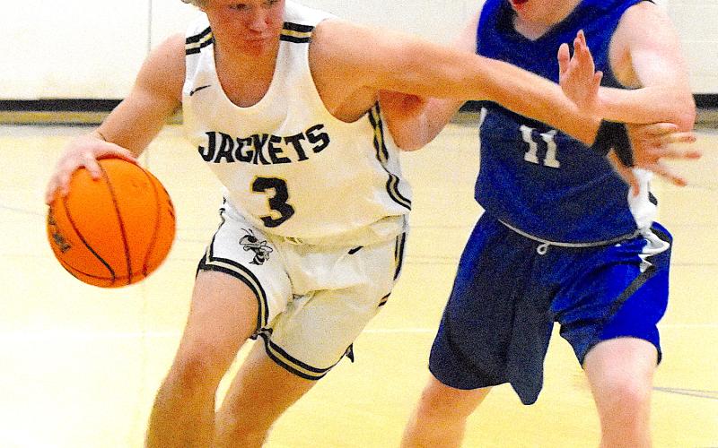 E.J. Abrams, No. 3, thunders down the lane during his 32-point explosion against Hiwassee Dam.