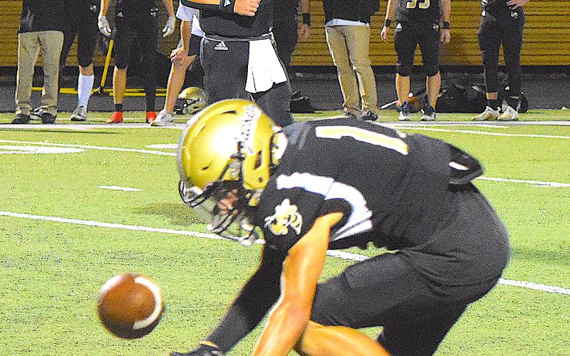 Gary Corsair • Clay County Progress Hayesville wide out Colton Bruggers, No. 11, reaches for a pass from Tate Roberts, No. 5, in the Yellow Jackets' 14-6 victory over Andrews.