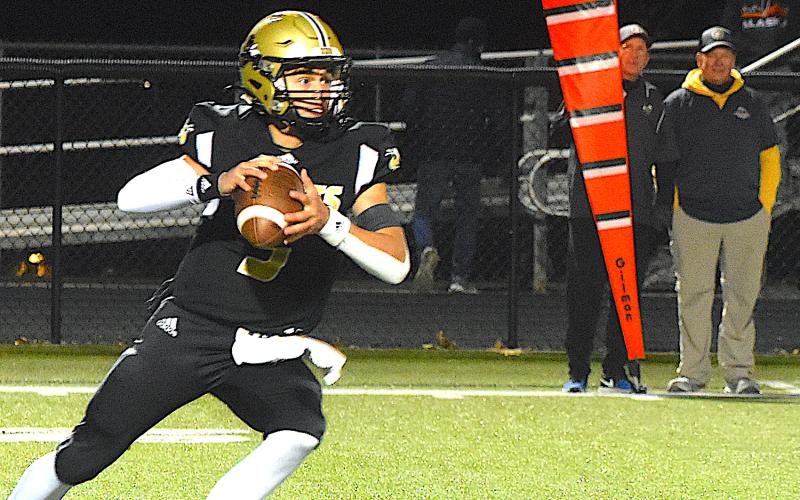 Gary Corsair • Clay County Progress Hayesville signal-caller Tate Roberts, No. 5, sets up to throw as the offensive line provides perfect protection.