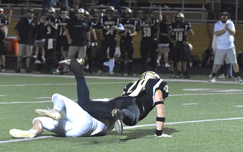 Gary Corsair • Clay County Progress Hayesville linebacker Taylor McClure flattens Andrews running back Holden Todd for a loss on a crucial third-down play midway through the fourth period.