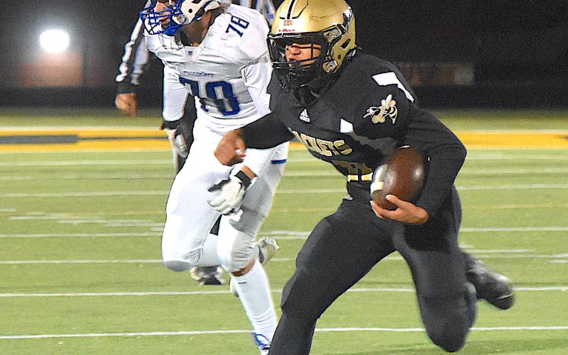 Gary Corsair • Clay County Progress Cole Vining, No. 10, gallops toward the sideline in picking up a Hayesville first down against Christ The King.