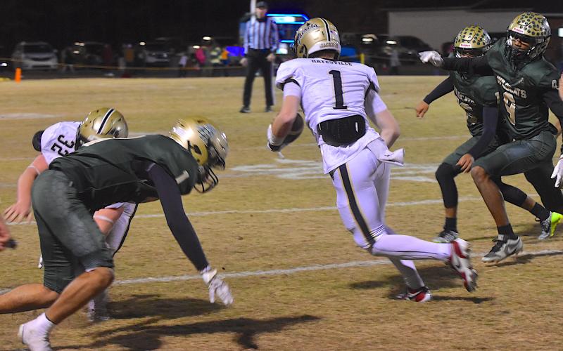 Gary Corsair • Clay County Progress Dawson Devane, No. 32, blocks a Wildcat defensive back as Peyton Mcgaha, No. 1, scoots through an opening.