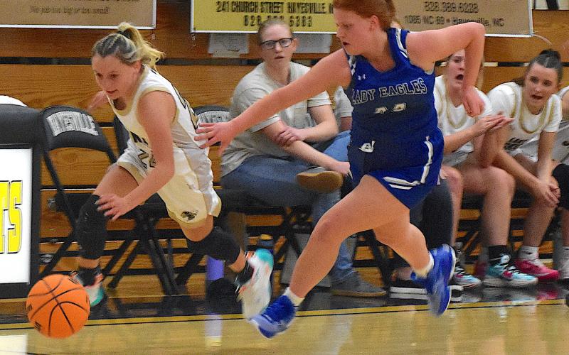 Gary Corsair • Clay County Progress Hayesville guard Emma Ashe, No. 24, turns on the afterburners as she chases down a lost ball against Hiwassee Dam.