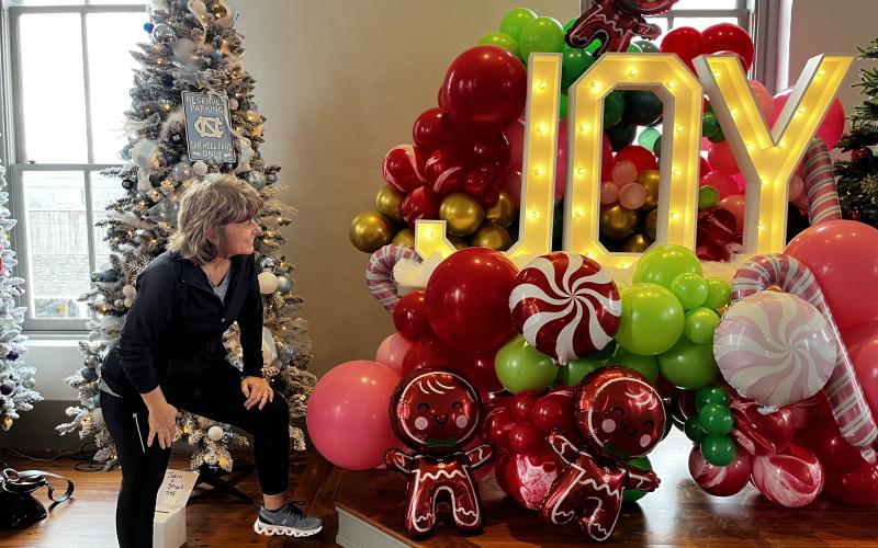 Deby Jo Ferguson • Clay County Progress Elane Epts from Griffin, Ga. visiting her sister in Hayesville gets a pleasent surprise at Festival of Trees.
