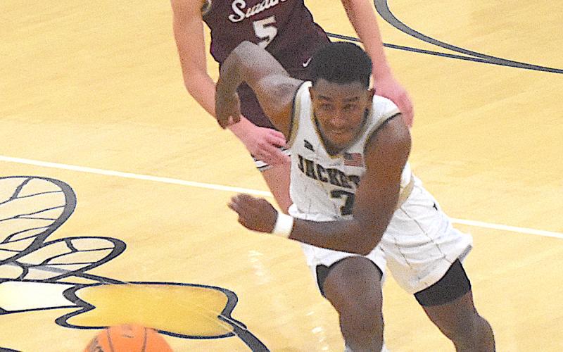 Gary Corsair • Clay County Progress Yellow Jacket guard Asher Brown, No. 2, runs down a loose ball.