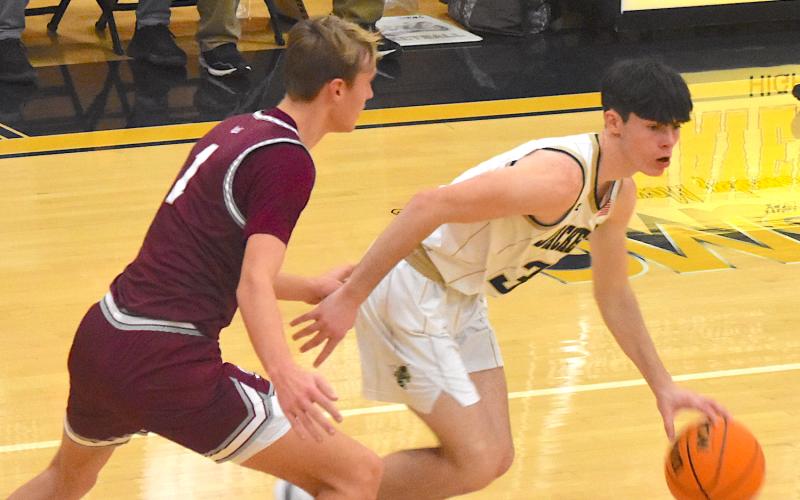 Gary Corsair • Clay County Progress Hayesville's Slade Crouch, No. 3, zooms through Swain County's oppressive full-court press.