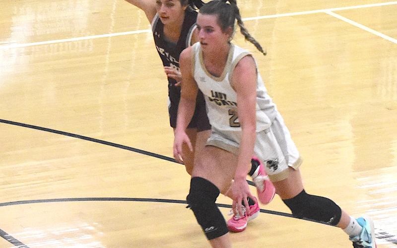 Gary Corsair • Clay County Progress Yellow Jacket guard Ava Shook, No. 2, breaks through the Maroon Devil's full-court press.