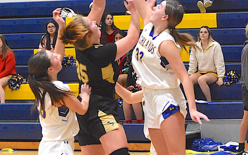 Gary Corsair • Clay County Progress Hayesville center Mallory Peck, No. 35, spins to the basket.