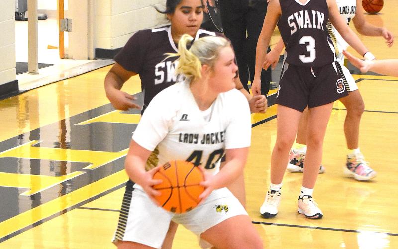 Gary Corsair • Clay County Progress Hayesville's Ava Moore, No. 40, goes to work on the low block against Swain County while Aaliyah Jackson, No. 2 looks on. Moore led the Yellow Jackets in scoring with 10 points.