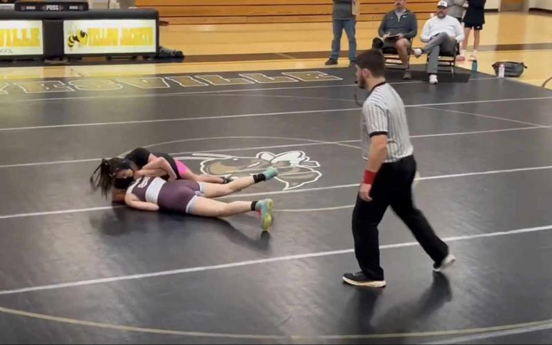 Amyna catching her opponent in a cow catcher right before pinning her opponent.