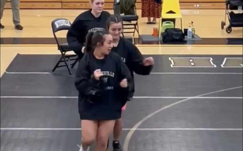 Front to back, Lilli Denton, Amyna Denton and Star Shelton warming up before the first home match.