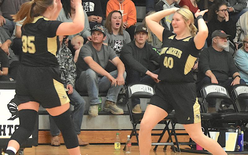 Gary Corsair • Clay County Progress Mallory Peck, No. 45, and Brooke Graves, No. 40, celebrate with a high five after Hayesville’s thrilling come-from-behind 48-47 over-time victory over Robbinsville on Friday.