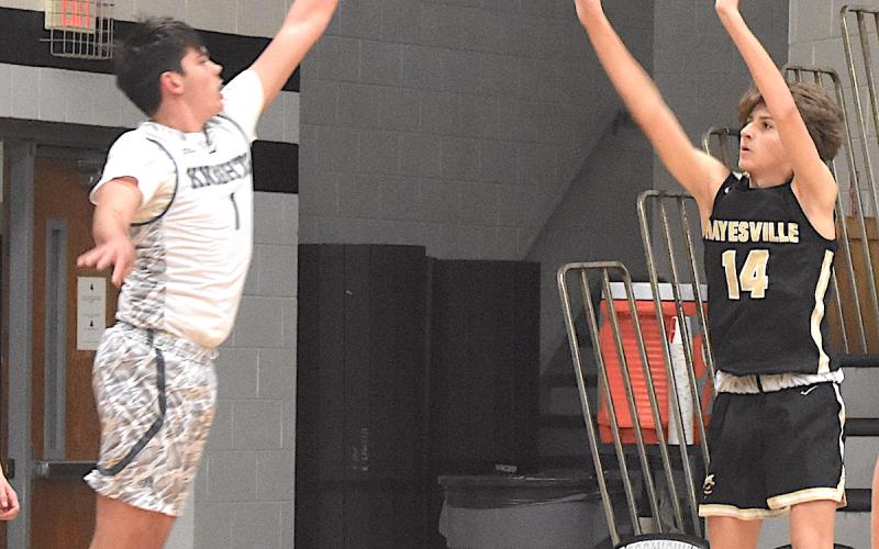 Gary Corsair • Clay County Progress Brady Reynolds, No. 14, punishes Robbinsville with a three-point bomb from the corner.