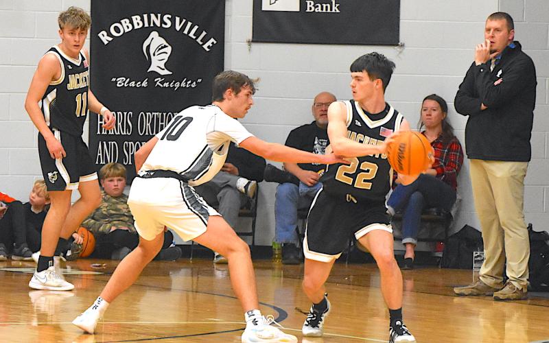 Gary Corsair • Clay County Progress Hayesville’s Jacob McClure, No. 22, looks for a cutter as Isaac Chandler, No. 11, spots up into the corner.