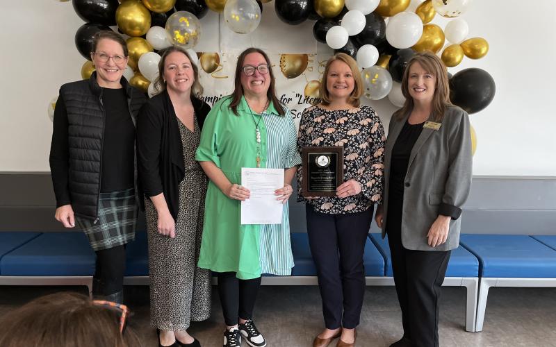 Deby Jo Ferguson • Clay County Progress From left, Early Education Consultant Carrie Bruns, Superintendent Melissa Godfrey, Instructional Coach Breeze Raxter, HPS Principal Heather Plemmons and Senior Director of Early Learning Amy Rhyne was presented the Western Region’s first Champion for Change Science of Reading Award.