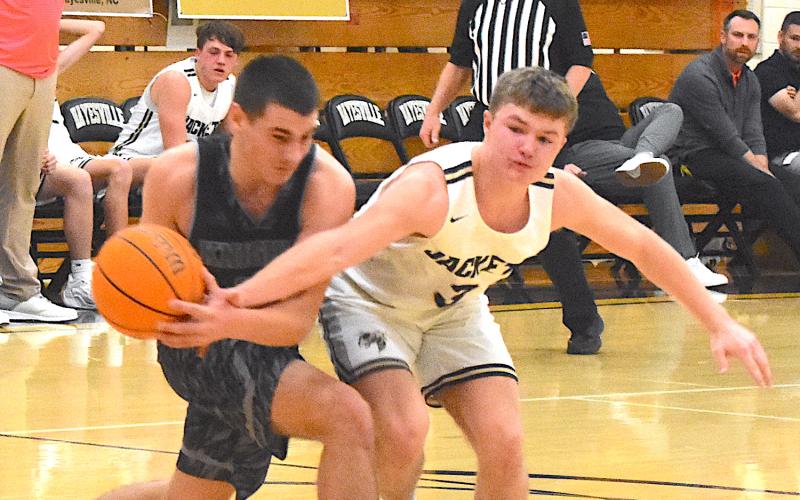 Gary Corsair • Clay County Progress E.J. Abrams, No. 3, tries to steal the ball at Robbinsville.