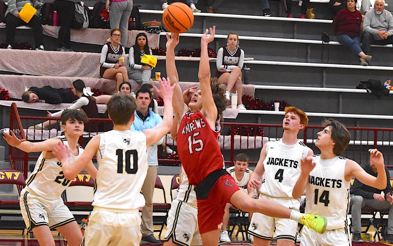 Gary Corsair • Clay County Progress Hayesville JV boys coach Zach Cottrell watches his troops swarm an Andrews shot. From left is Daemien Soto, No. 20; Brandon Lynch, No. 10, E.J. Abrams (behind shooter), Peyton McGaha, No. 4, and Brady Reynolds, No. 14.