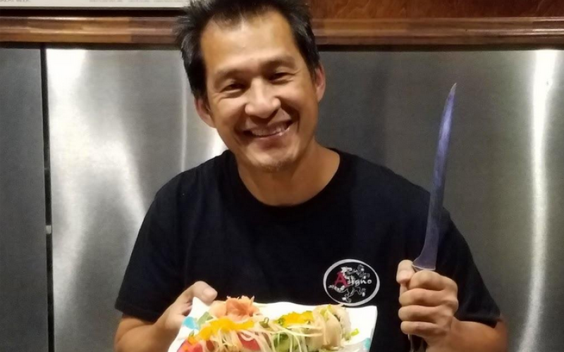 Koo Lim at their family restaurant Asiano serving up a meal for patrons. He admted that breakfast is actually his favorite meal.