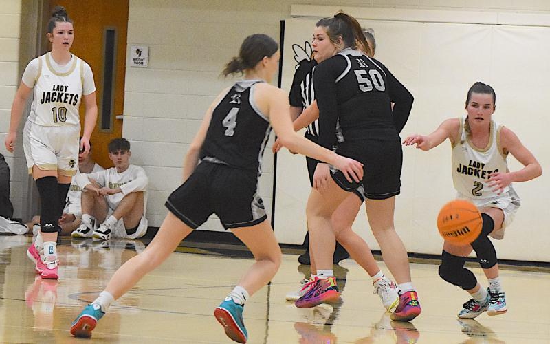 Gary Corsair • Clay County Progress Hayesville standout Ava Shook, No. 2, draws a bead on a loose ball at Robbinsville.